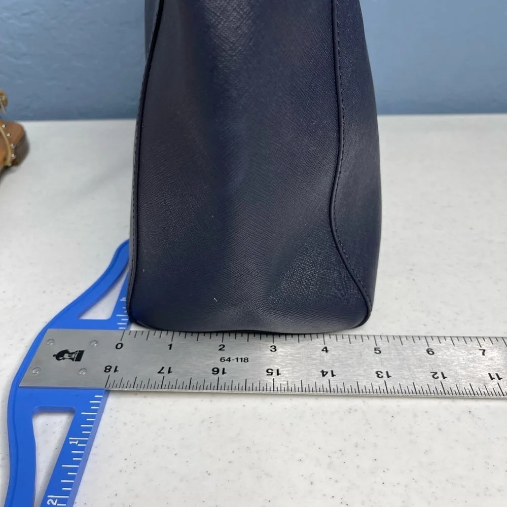 Tory Burch Saffiano leather medium Navy Blue top zip tote with material inside.